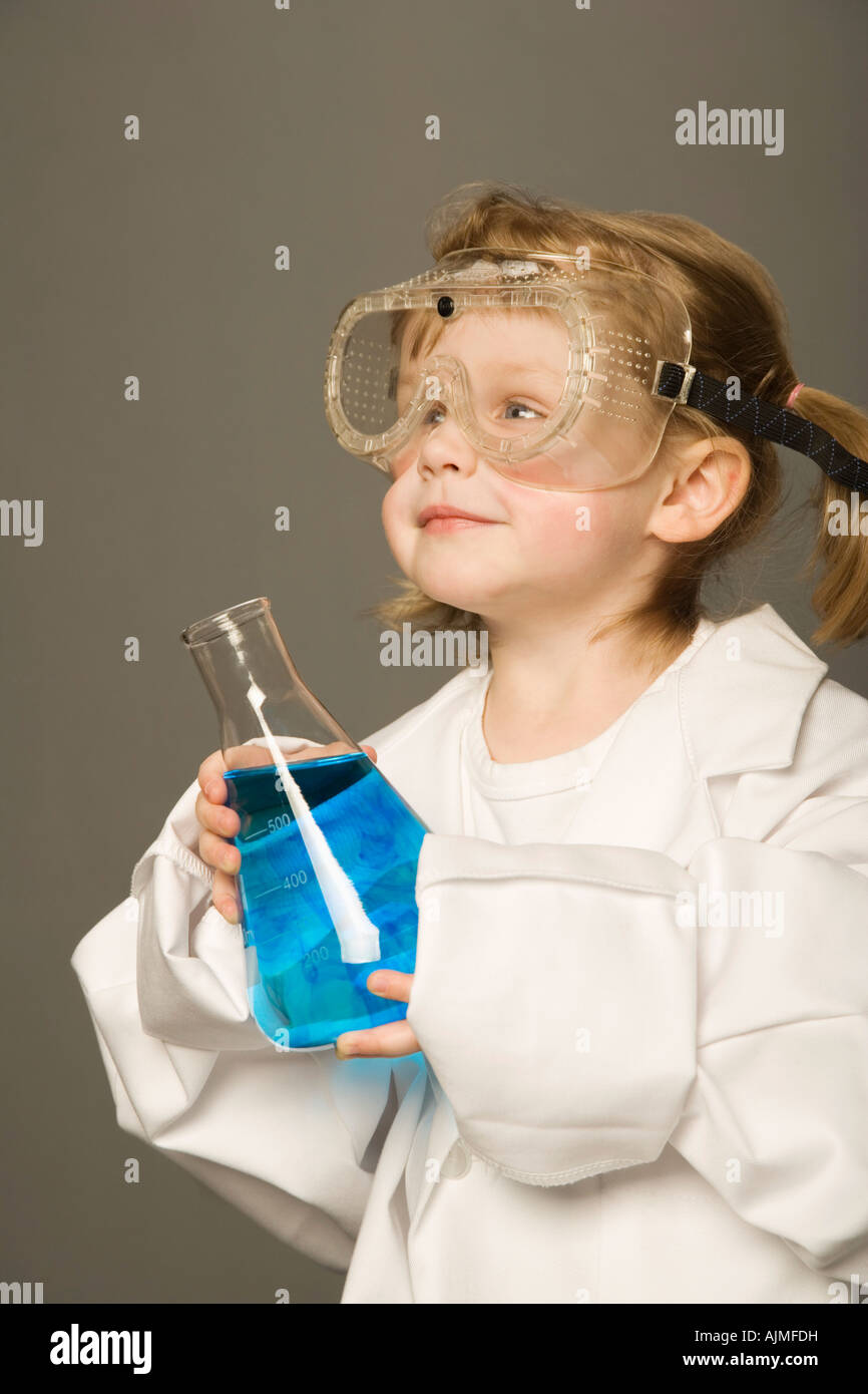 Little girl with safety goggles and science beaker Stock Photo - Alamy