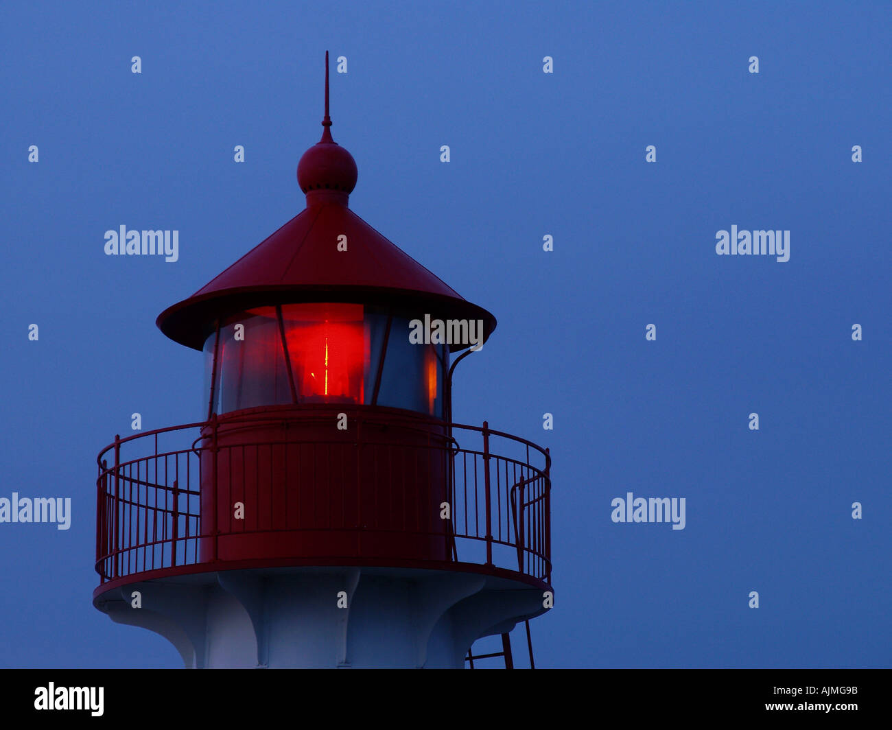 Lighthouse showing red light in the night Oddesund Denmark Western Jutland Stock Photo