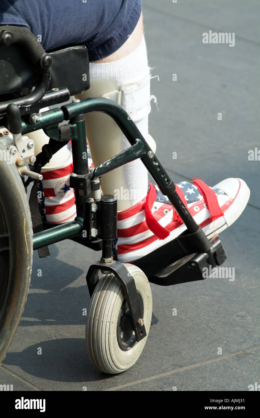 wheelchair bandaged damaged leg wearing stars and stripes shoe USA