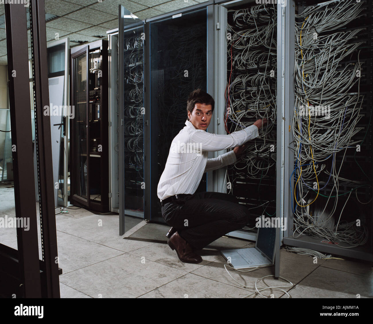 Man adjusting electrical cables Stock Photo Alamy