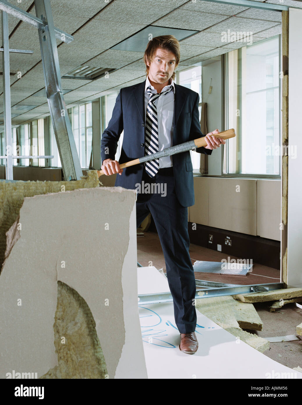 Businessman holding baseball bat Stock Photo