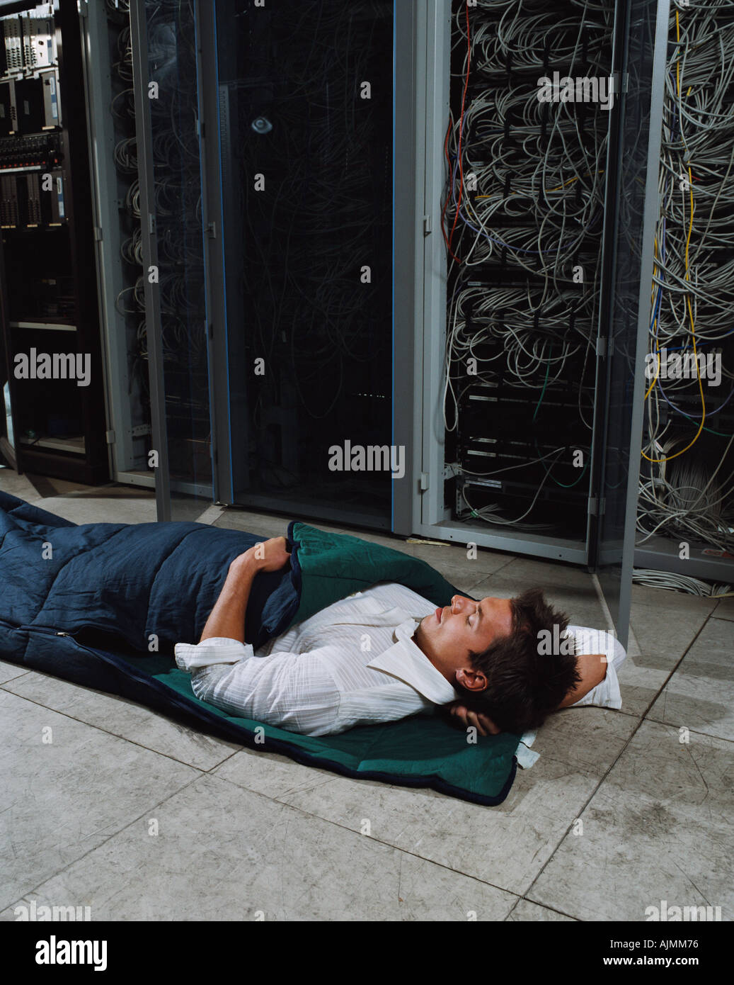 Man sleeping in office Stock Photo