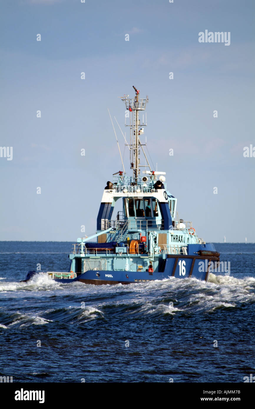 Peel a THRAX seagoing escort  tug outbound on Southampton Water Hampshire southern England UK Stock Photo