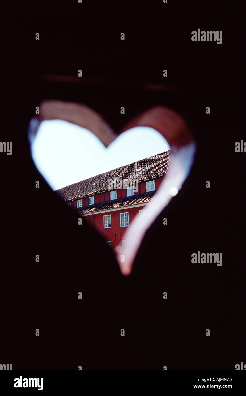 Heart shaped hole in door Stock Photo Alamy