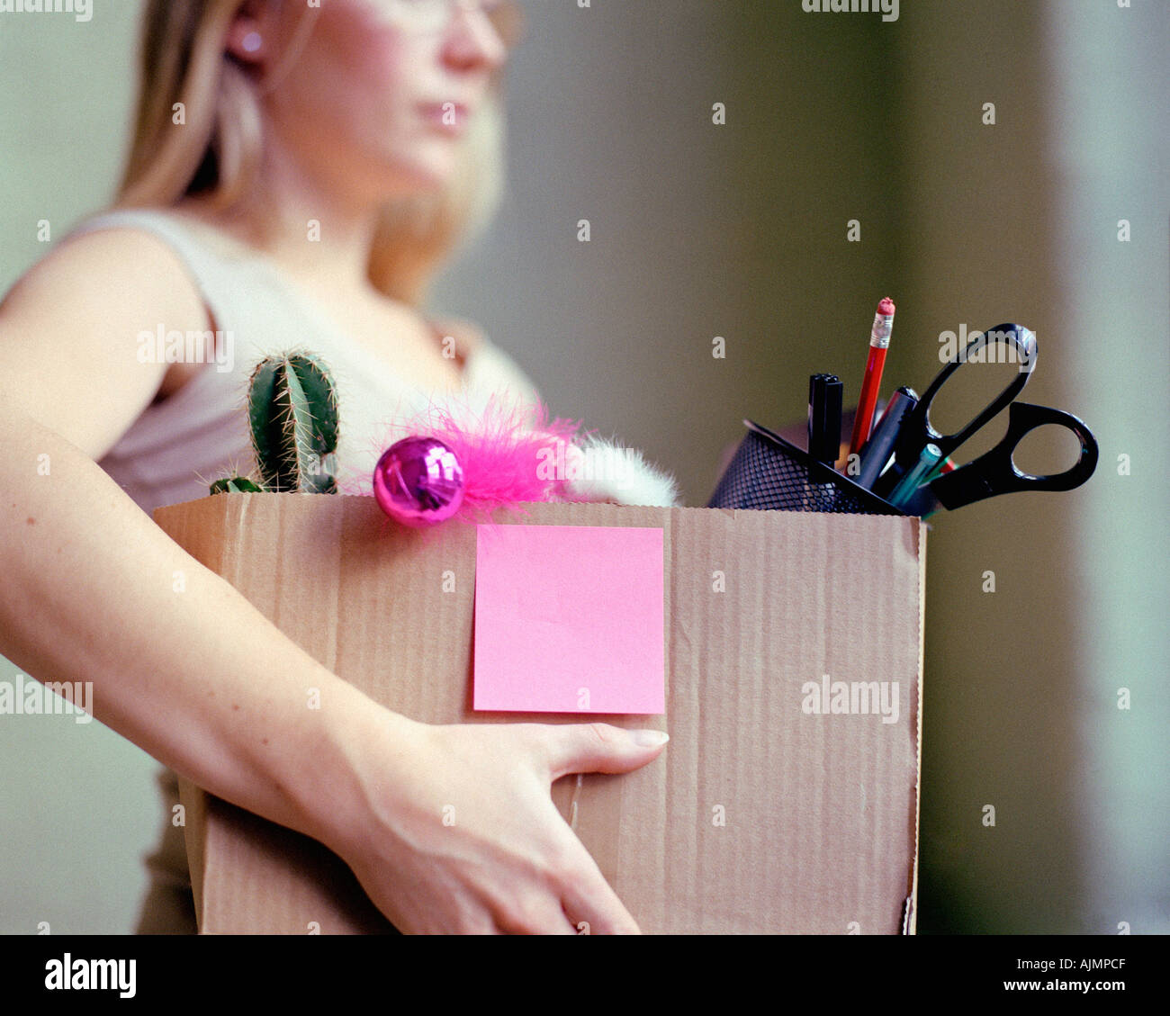 Woman carrying box of stationery Stock Photo Alamy
