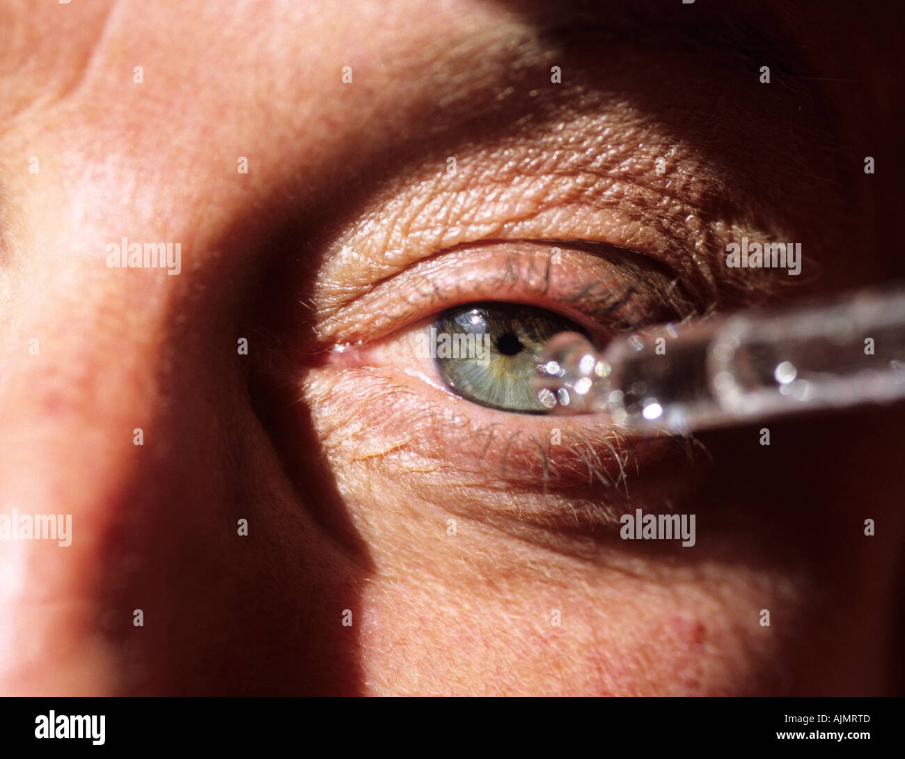 eye drops being self administered by a female Stock Photo Alamy