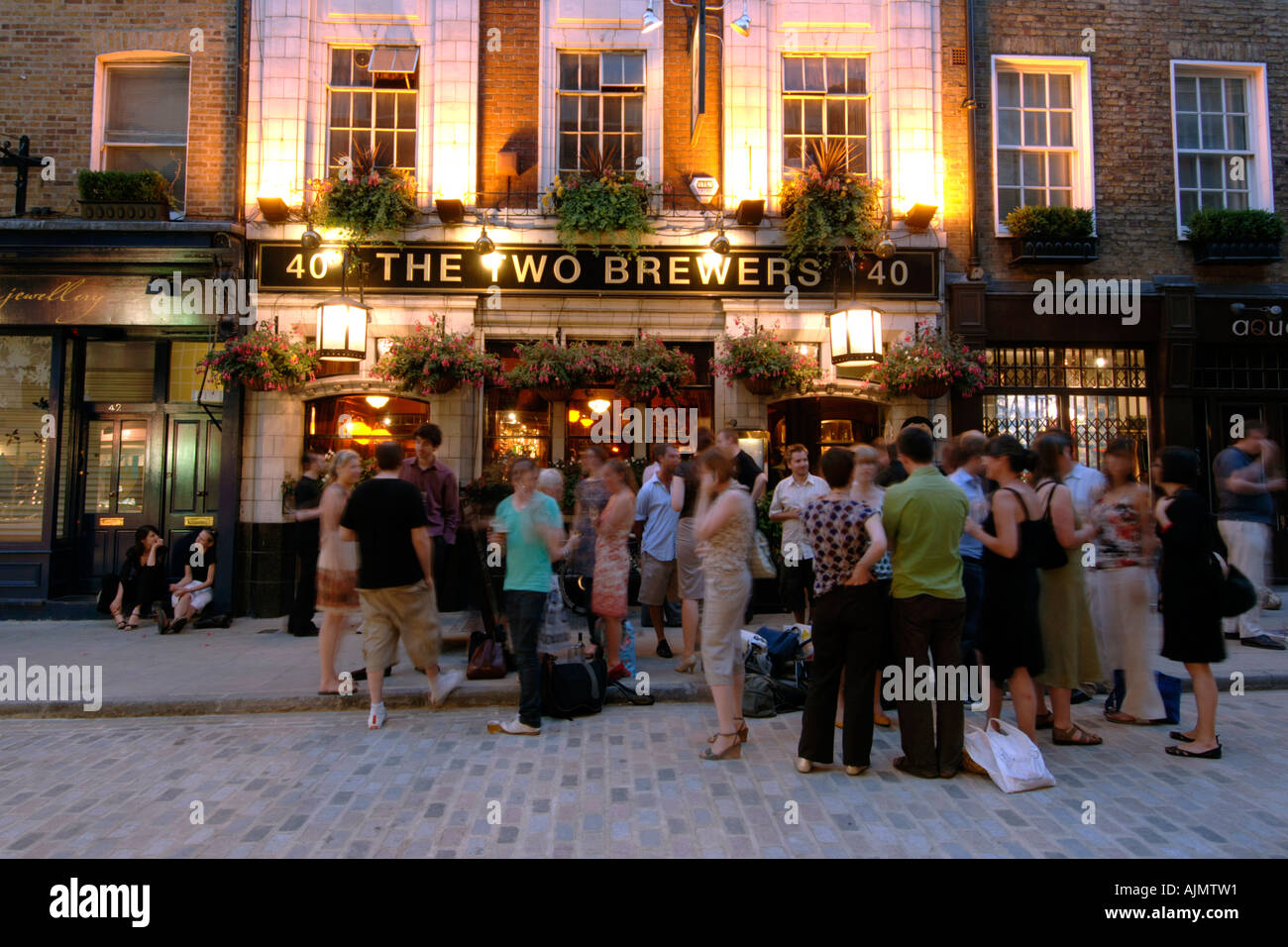 Patrons Drinking Outside The Two Brewers Pub In Covent Garden In London Stock Photo Alamy