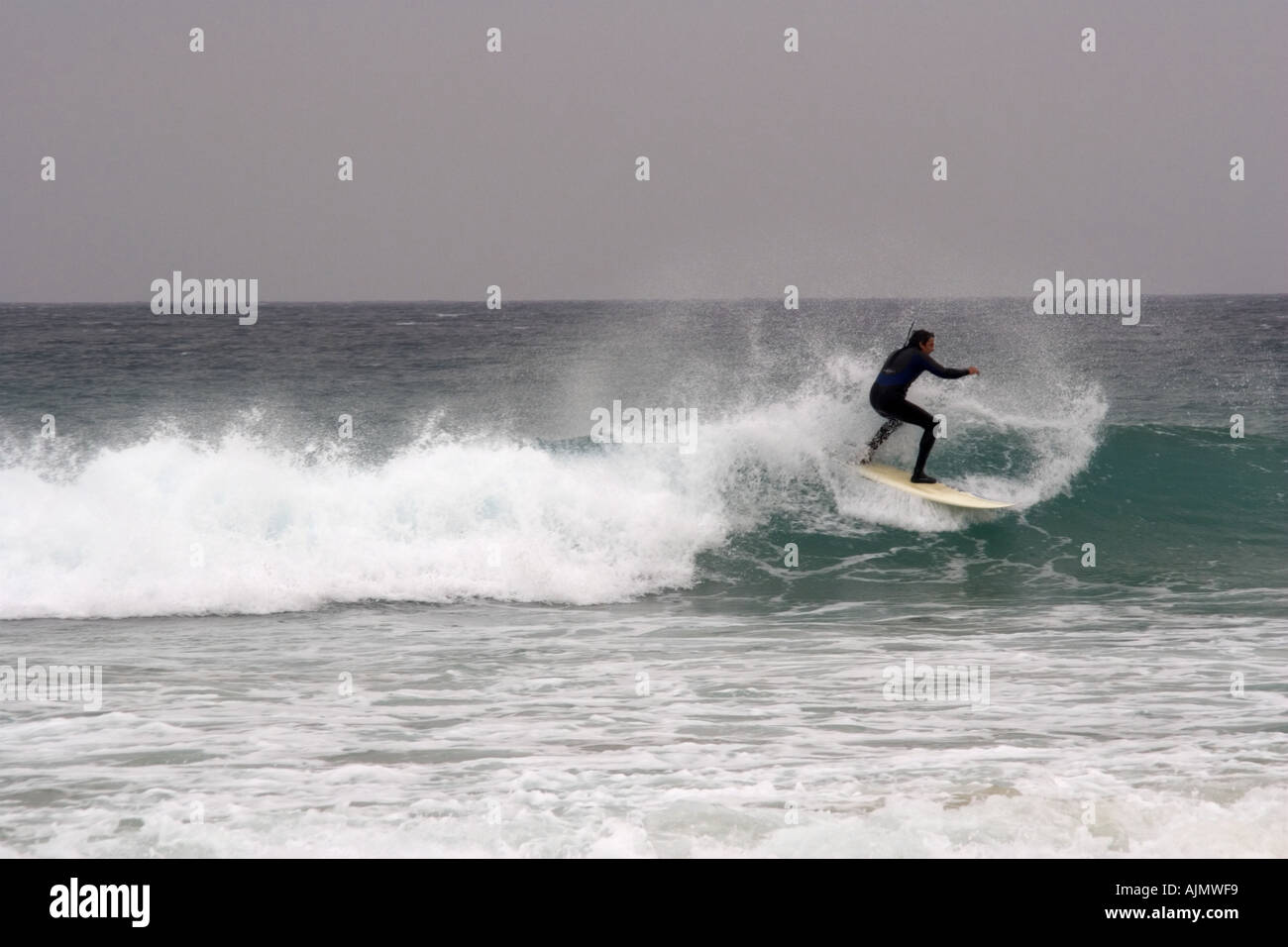 Surfing on Tarifa beach Stock Photo - Alamy