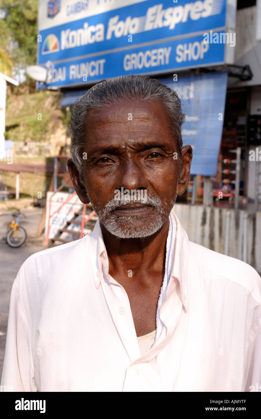 Portrait of a local man of Indian ethnicity at Batu Ferringhi on Penang Island, Malaysia. Stock Photo