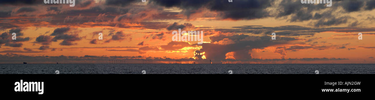 stormy sunset showing gas rig and wind turbines out to sea blackpool ...