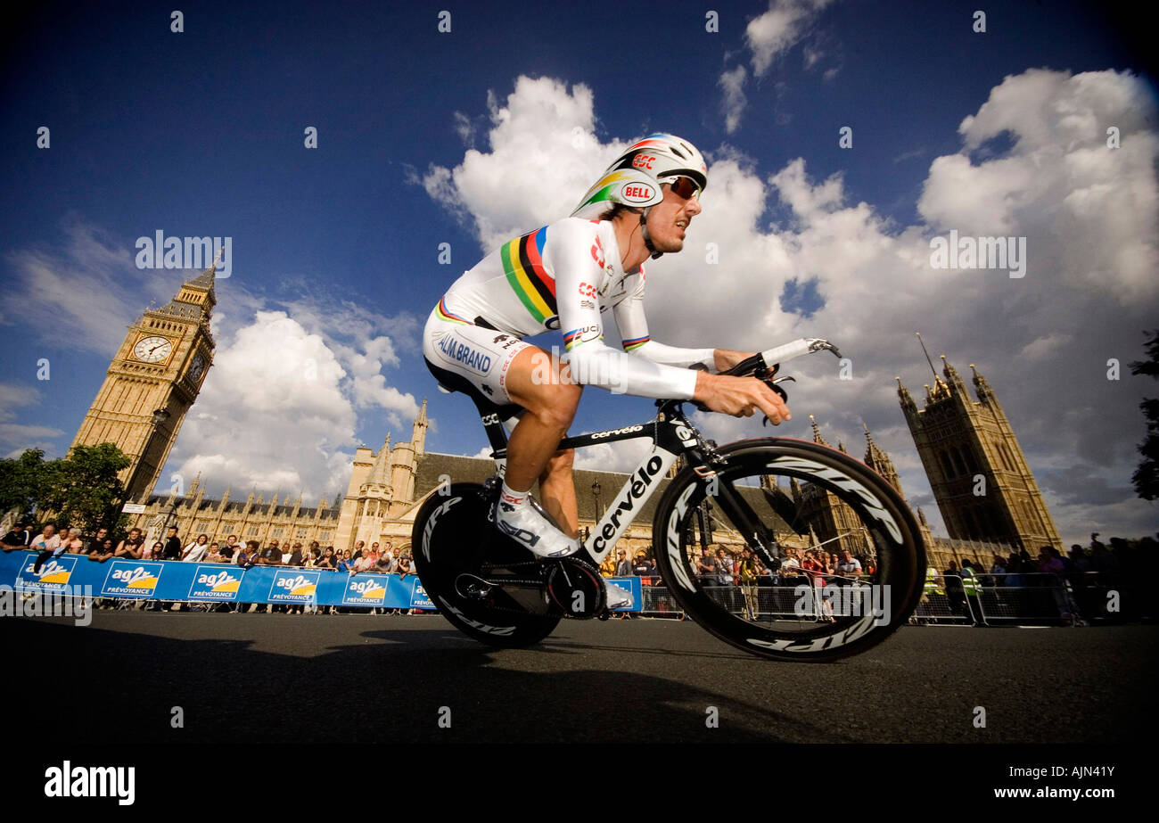 Fabian Cancellara passes the Houses of Parliament on his way to winning the prologue stage of the Tour de France in London, UK Stock Photo