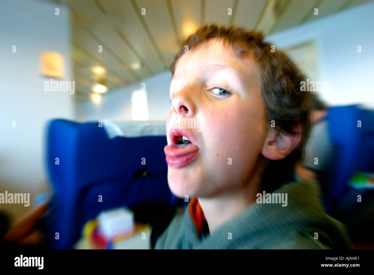 BOY PULLING FACE Stock Photo