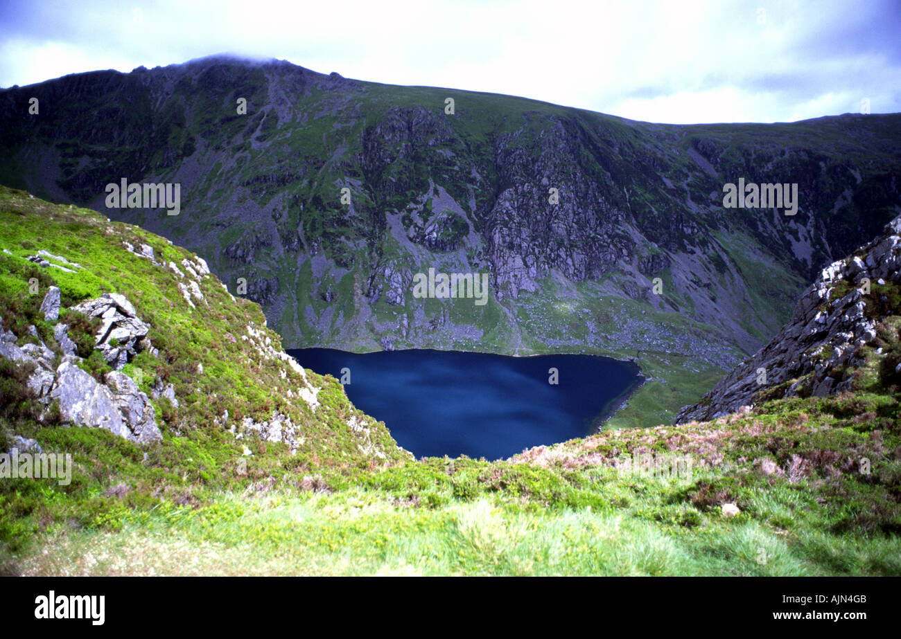 Blue lake of Cau in the Cadair Idris mountain range Wales UK Stock Photo
