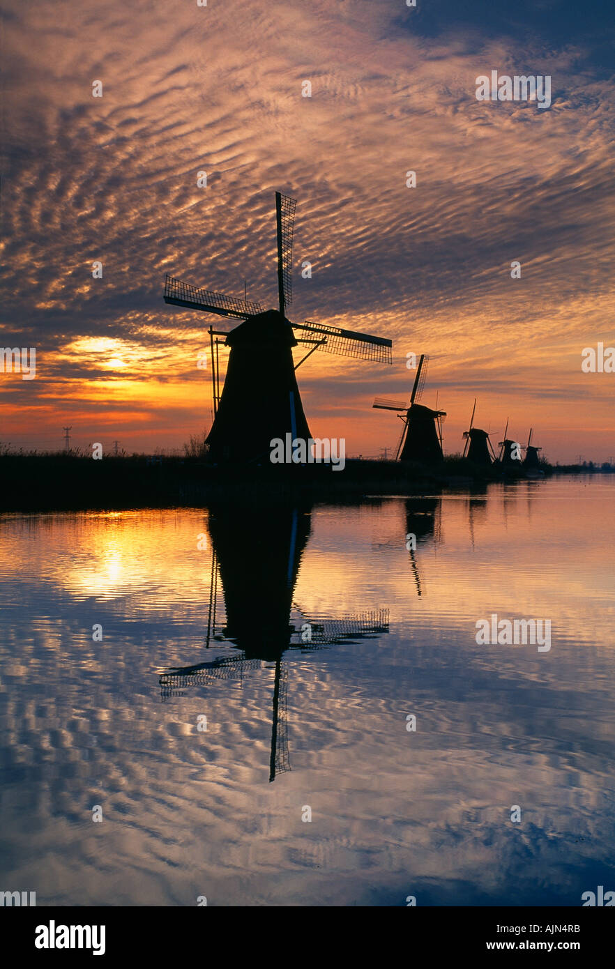 sunrise over the windmills at Kinderdijk Holland Stock Photo