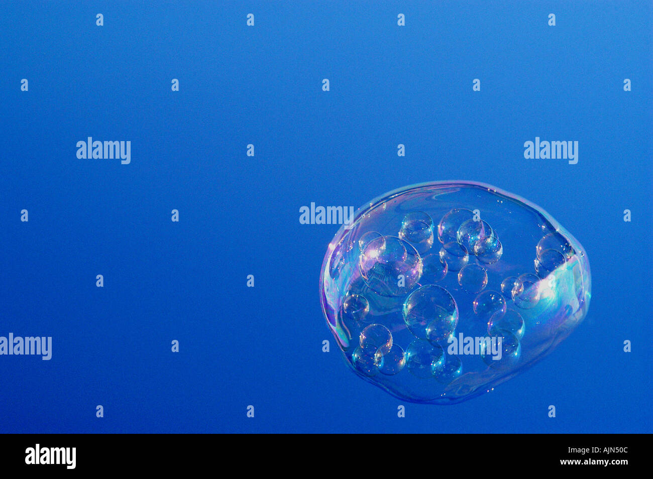 Lots of bubbles in blue sky hi-res stock photography and images - Alamy