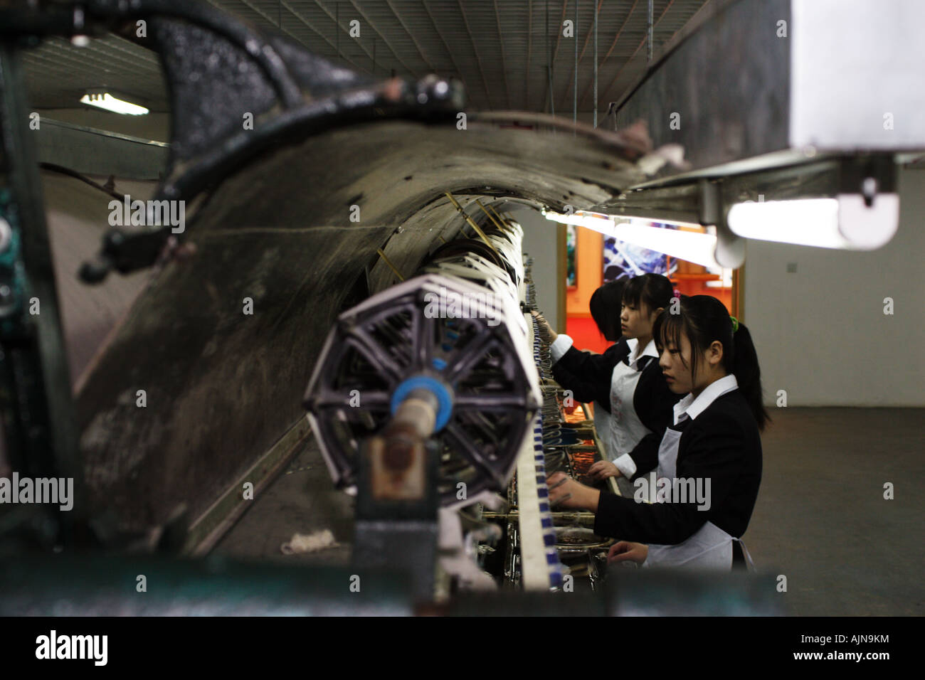 Women work in a Shanghai Silk Factory. Stock Photo