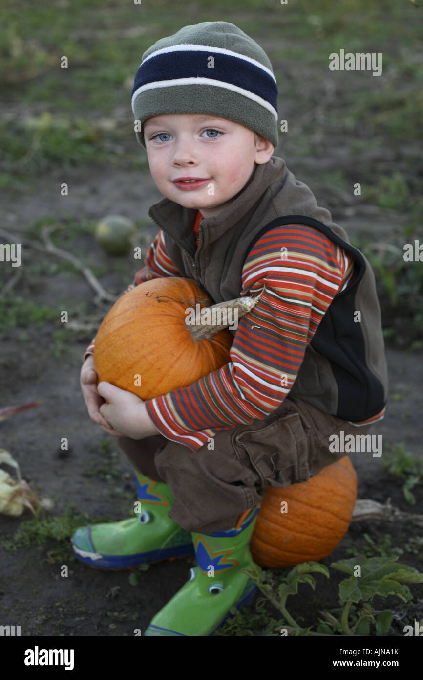 Young boy with pumpkin Stock Photo