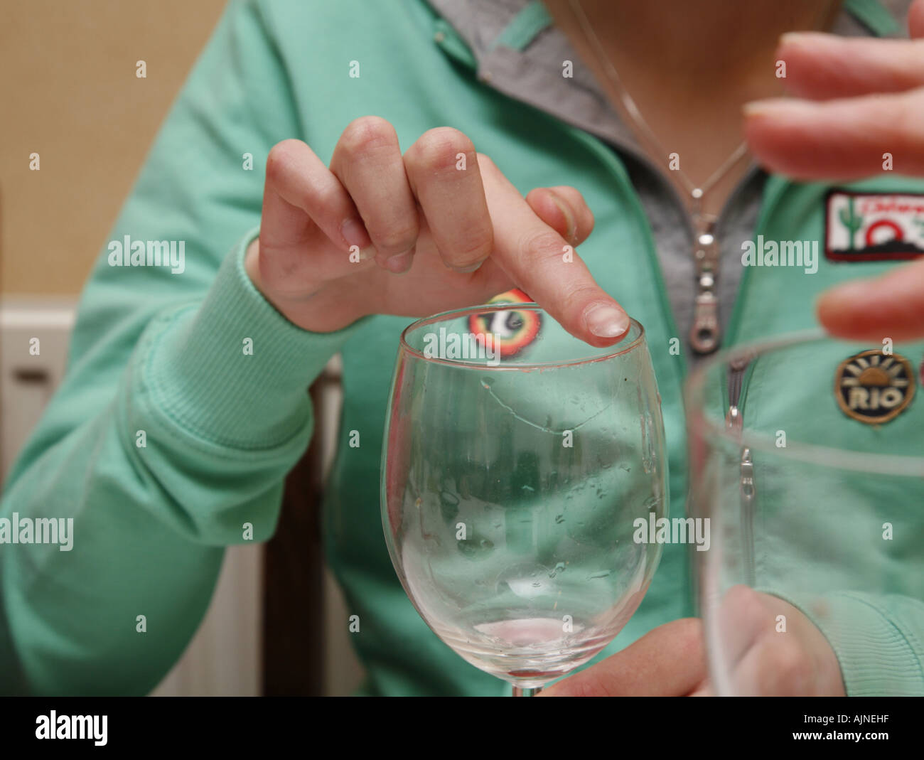 Making a wine glass sing at a party Stock Photo Alamy