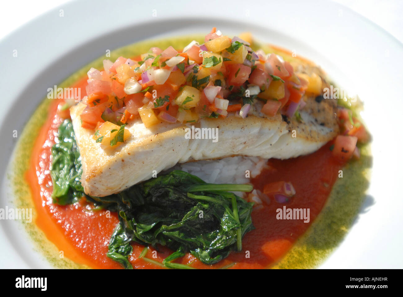 Tilapia with a Mango Salsa seafood dish Stock Photo Alamy