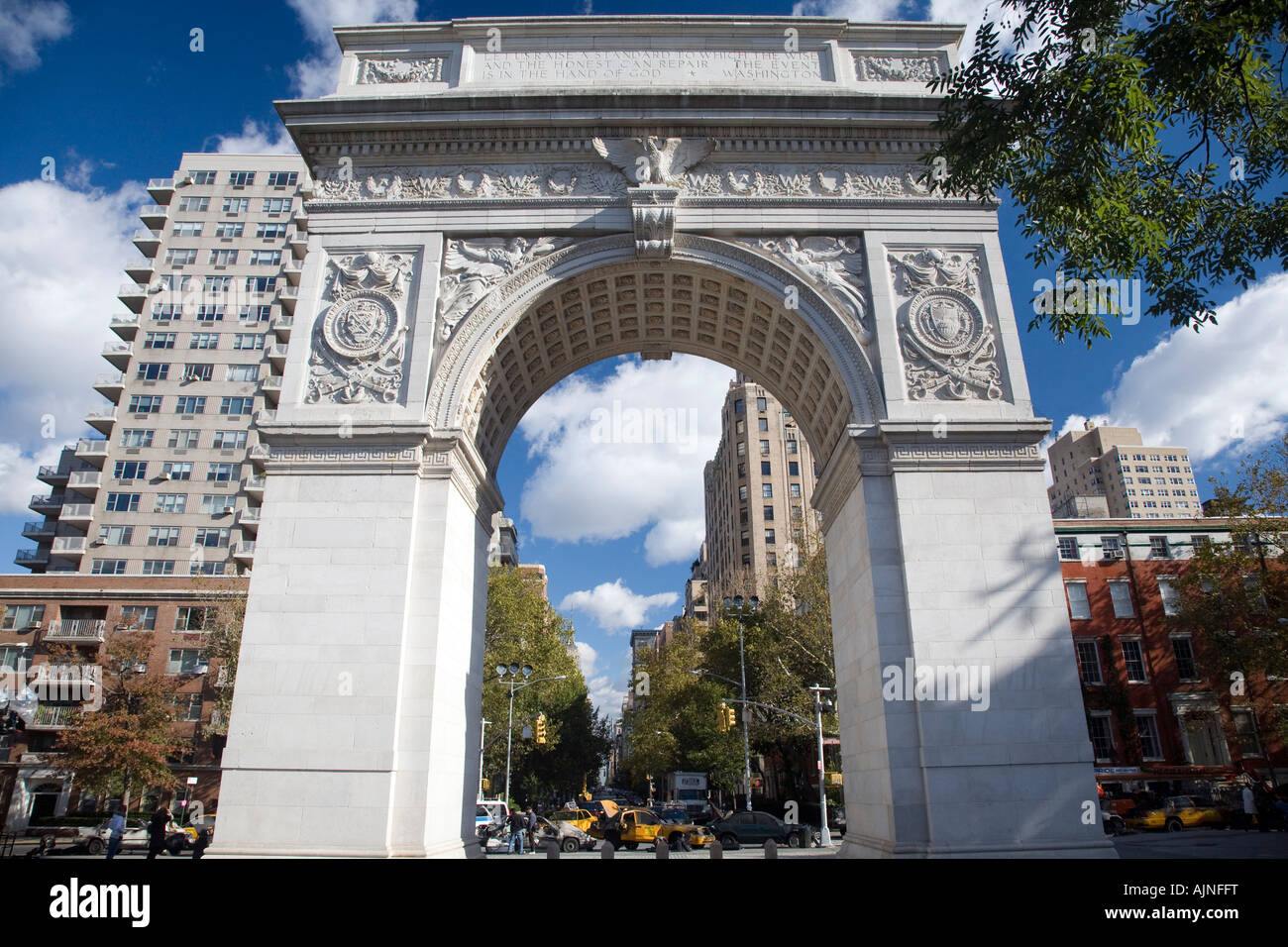 View of the 5th Avenue in NYC through the Arch of Washington Square, USA. Stock Photo