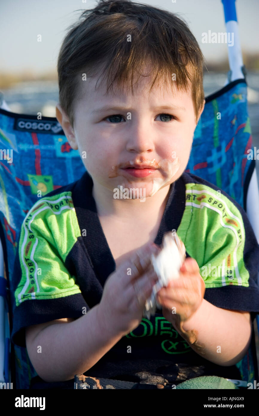 Toddler after eating an ice cream cone Stock Photo Alamy