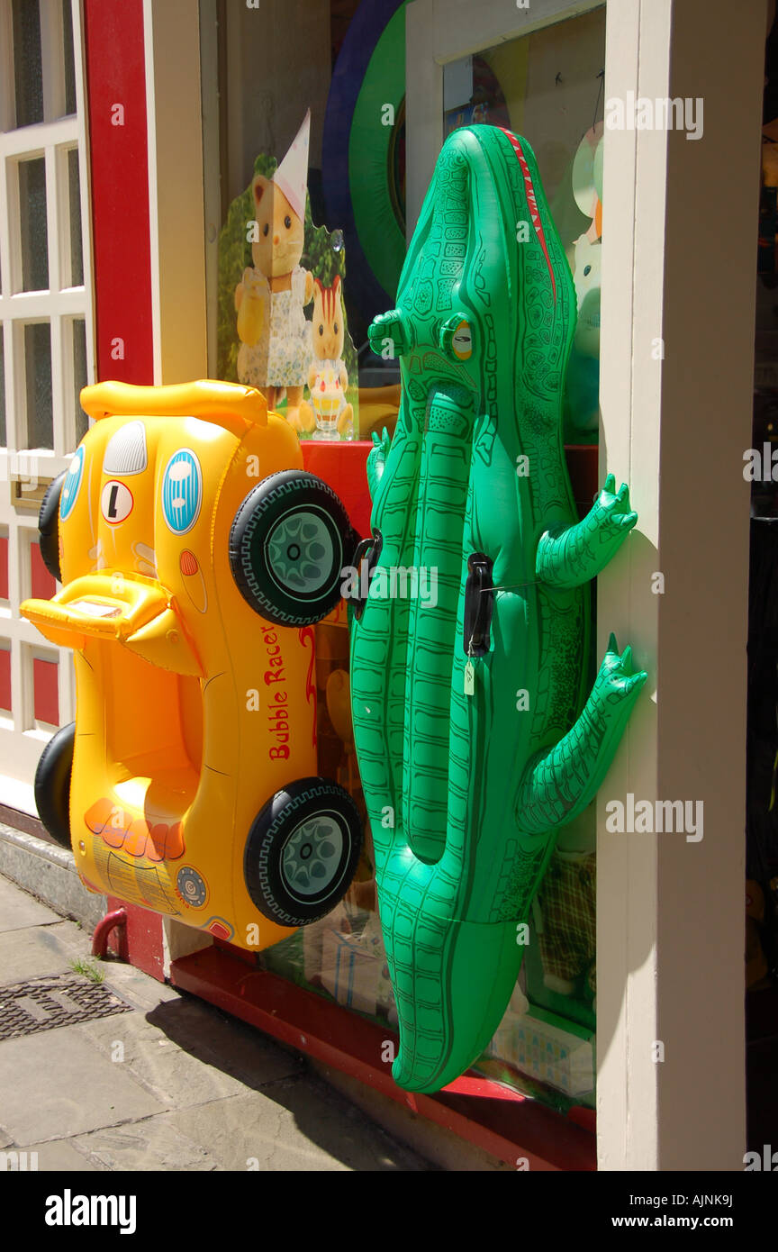 Inflatable beach toys outside a shop, UK Stock Photo Alamy