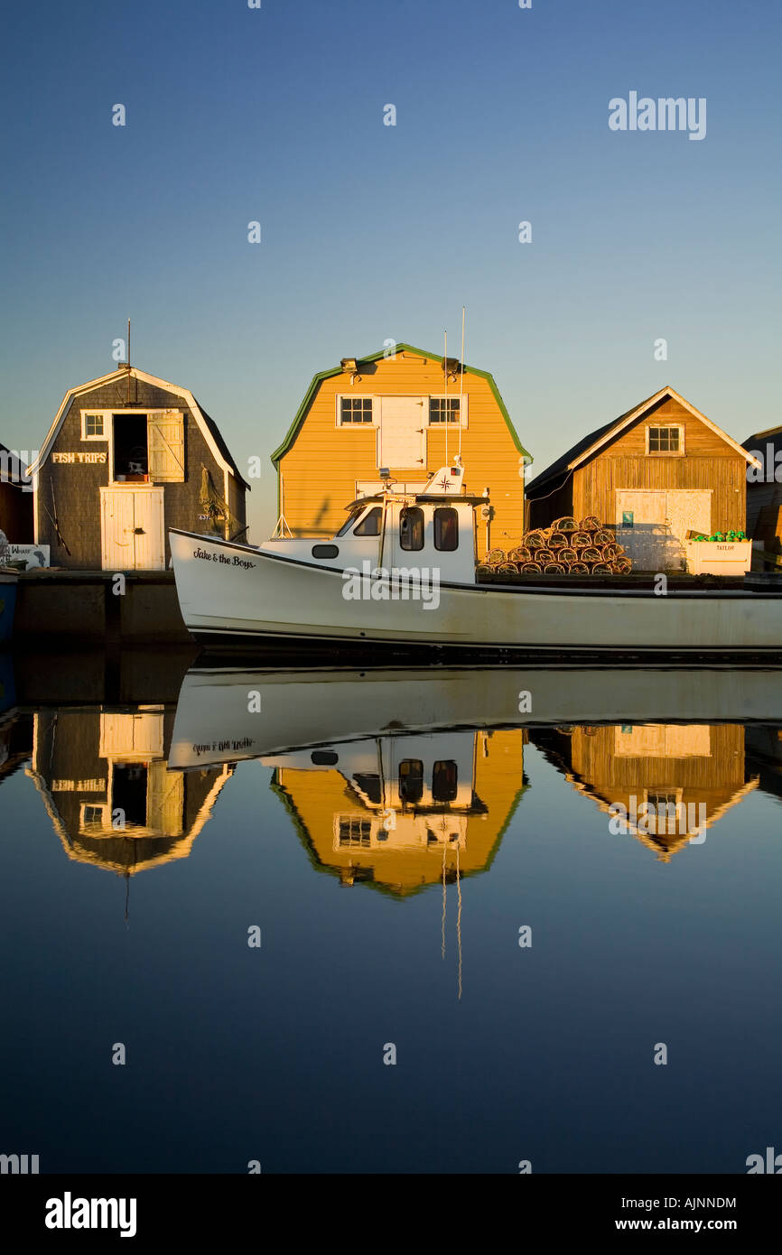 Fishing boat and fish sheds, New London, Prince Edward Island, Canada Stock Photo