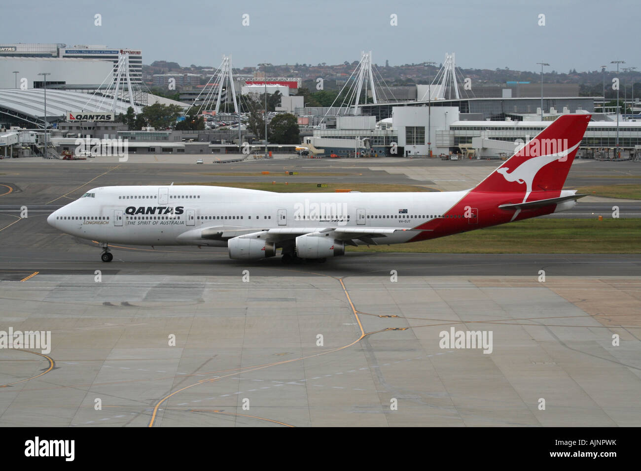 Qantas Boeing 747-400 jumbo jet taxiing at Sydney Airport, Australia. International air travel and long haul flights. Stock Photo