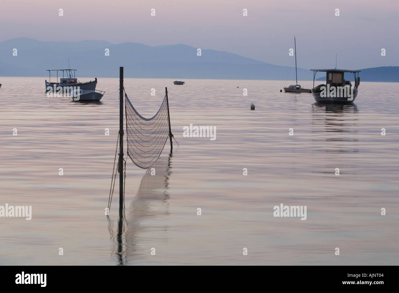 Side profile of a fishing net erected in the sea Stock Photo - Alamy