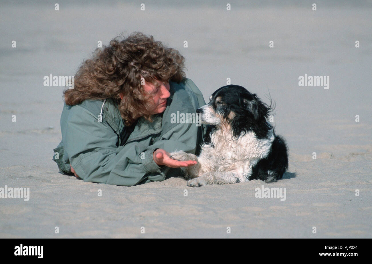 Woman and Mixed Breed Dog Stock Photo