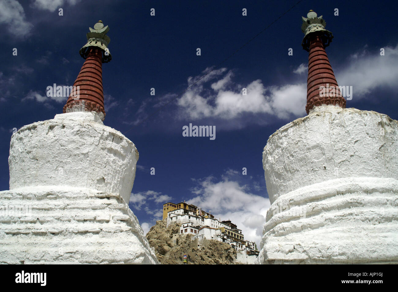 Two buddhist tibetan stupas and Thiksey monastery, Ladakh. Stock Photo