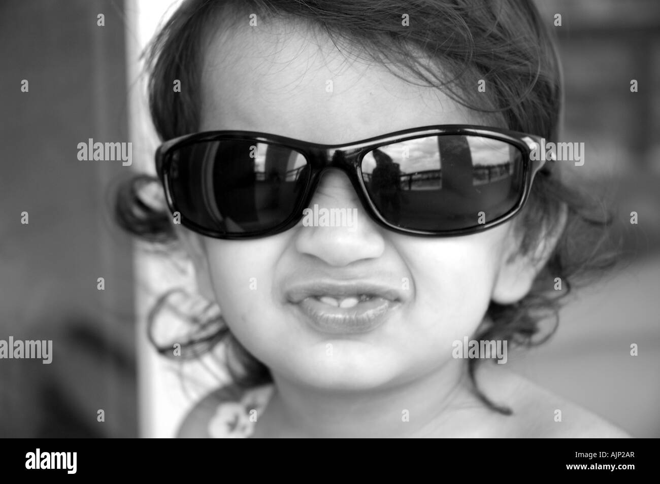 A small girl wearing goggles, Close-up Stock Photo