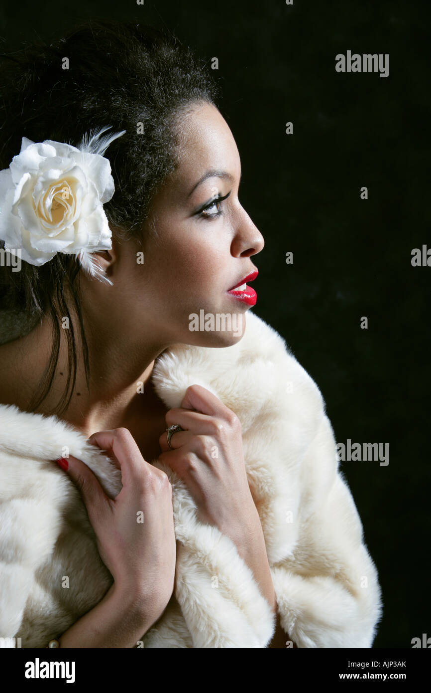 Girl in a White Fur Stole with a Flower in Her Hair Stock Photo