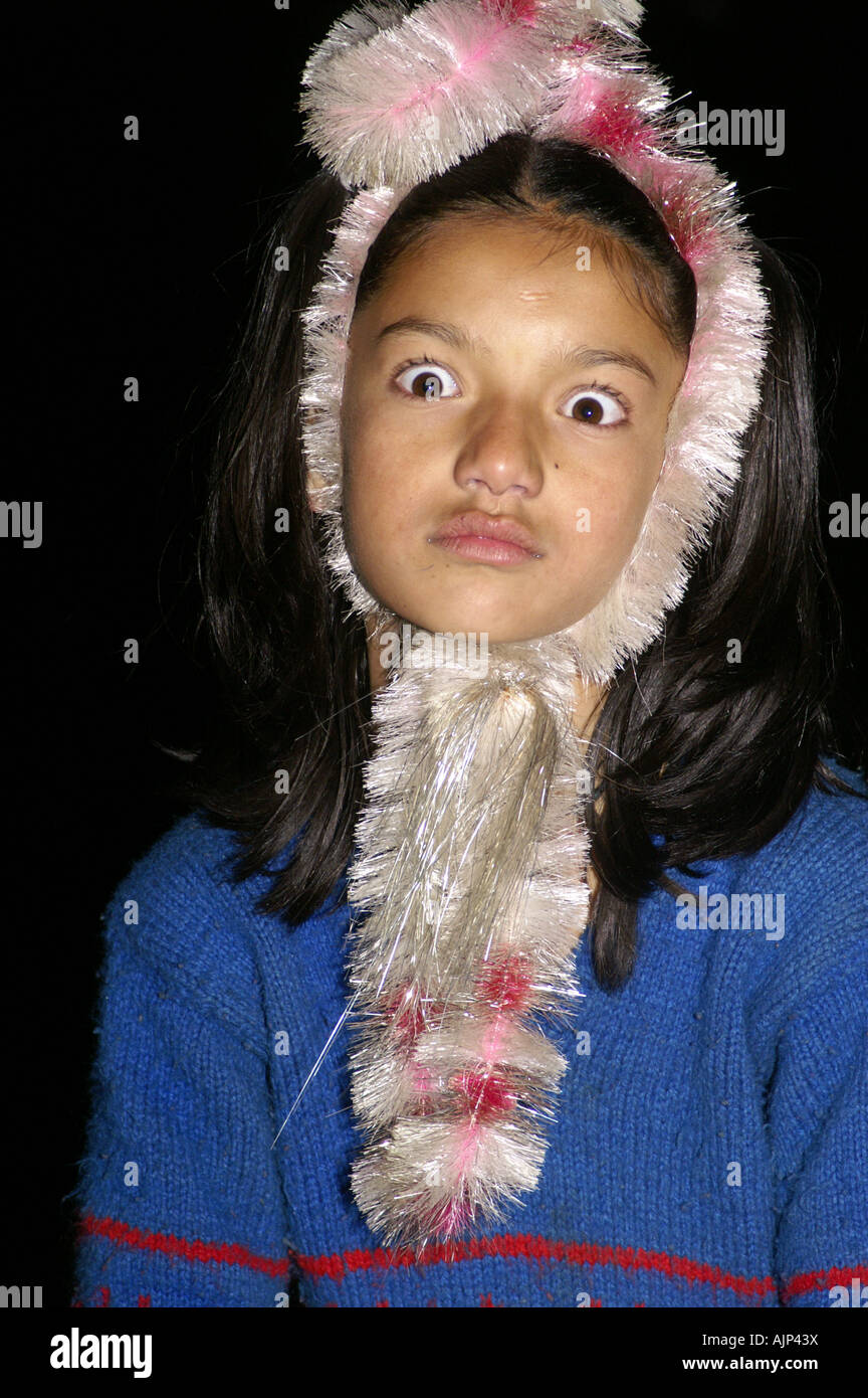 one young indian girl making funny faces hang Stock Photo - Alamy