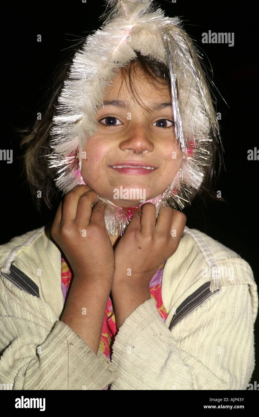 one young indian girl making funny faces hang Stock Photo - Alamy