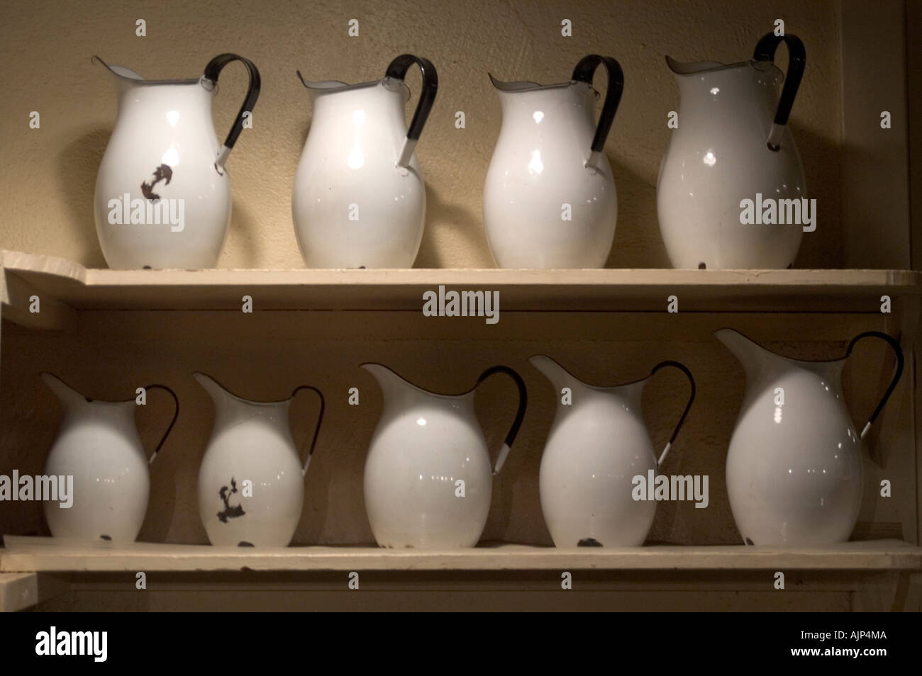 A row of white pitchers on a shelf Stock Photo - Alamy