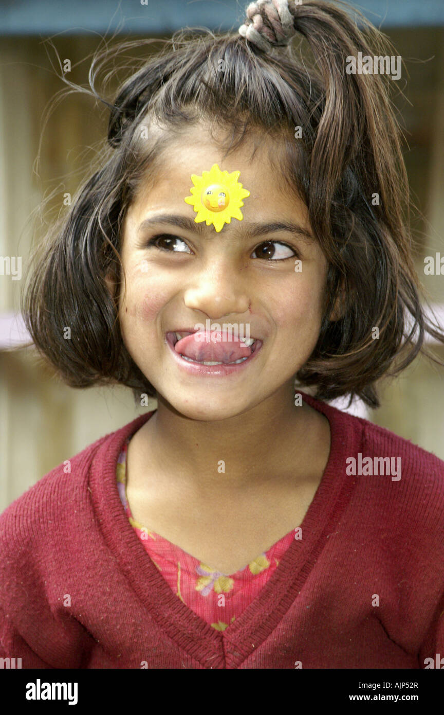 One indian girl child making funny happy faces Stock Photo - Alamy
