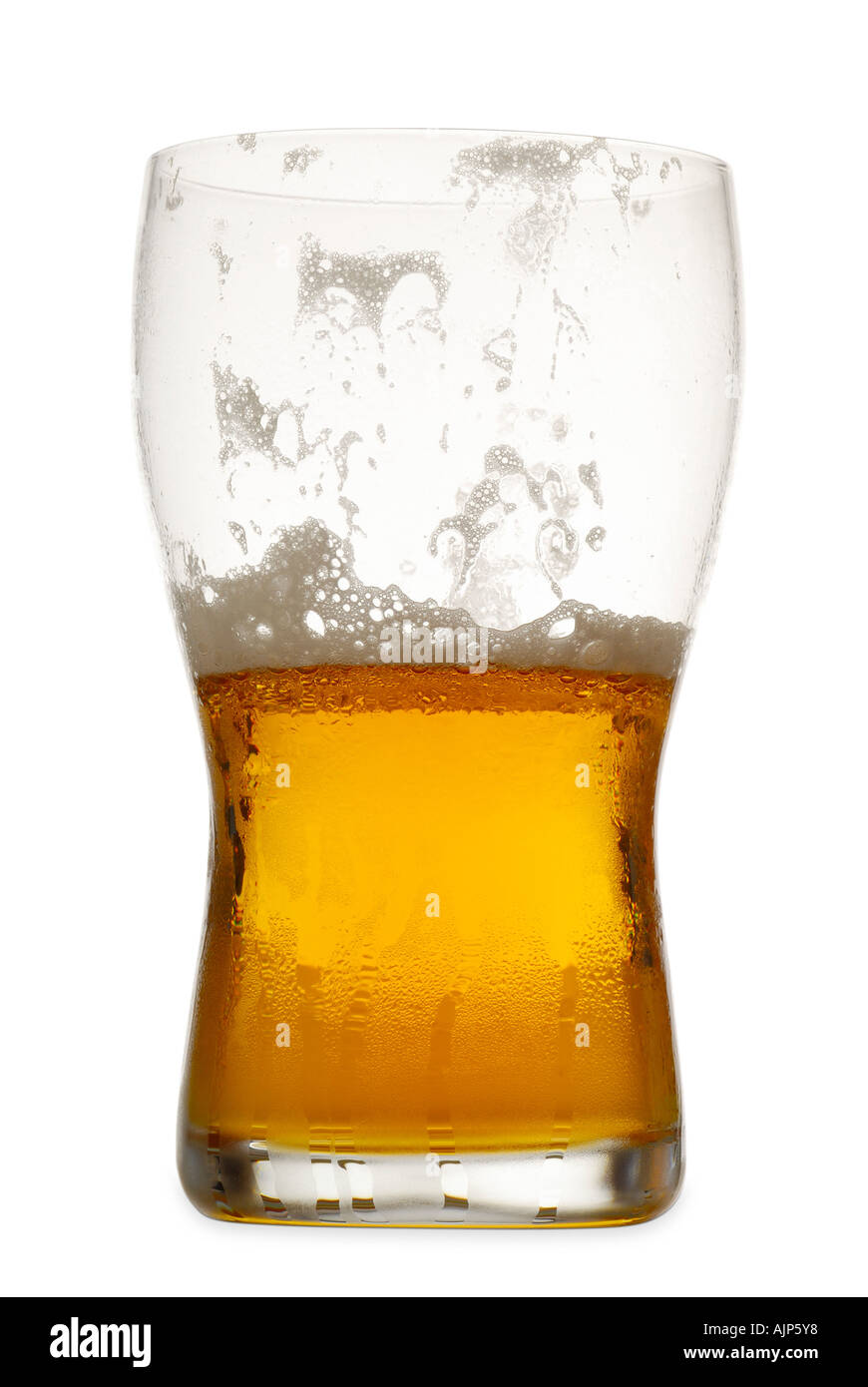 BEER HALF FULL PINT GLASS OF BEER LAGER SILHOUETTED ON WHITE BACKGROUND Stock Photo