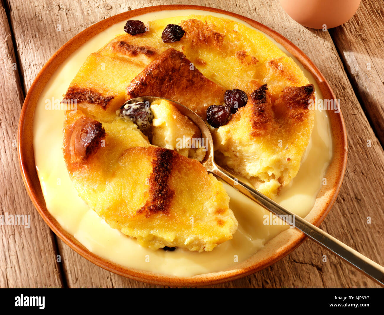 BREAD AND BUTTER PUDDING WITH CUSTARD Stock Photo Alamy