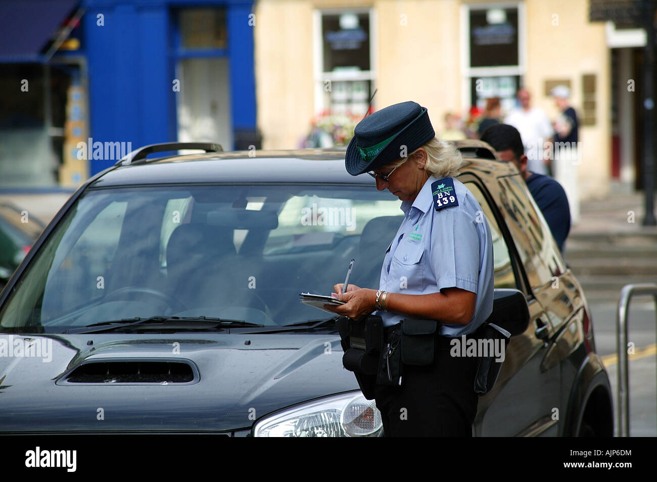 Traffic warden issuing a ticket Bath Stock Photo