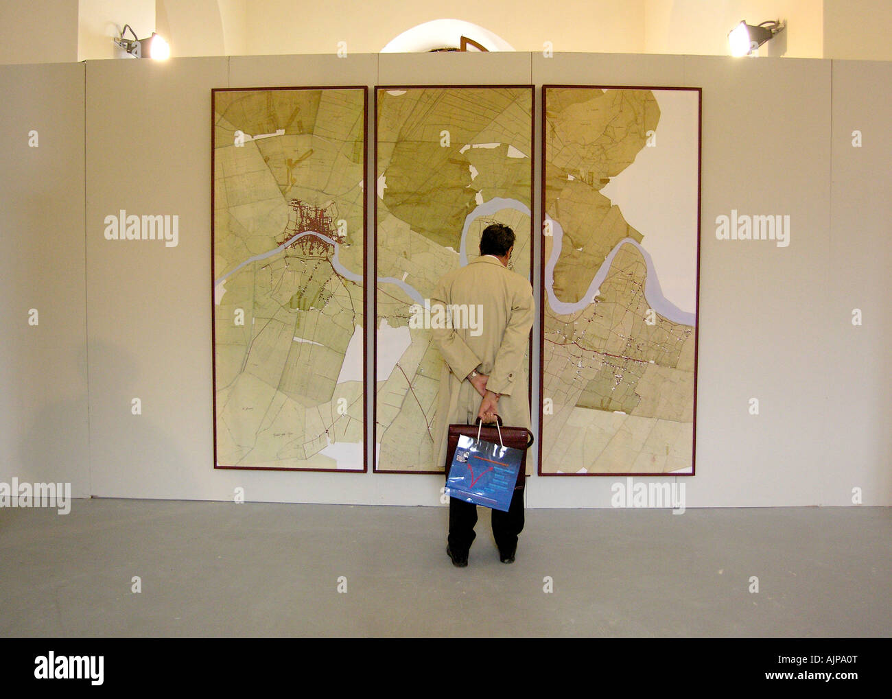 man looking at a geografic map Stock Photo