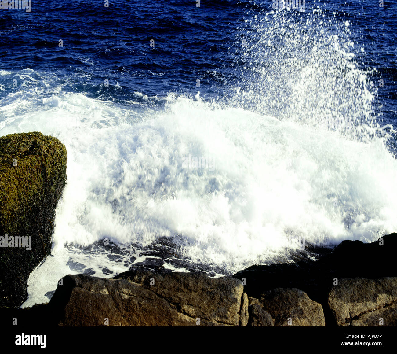 Waves crashing on rocky beach Stock Photo - Alamy