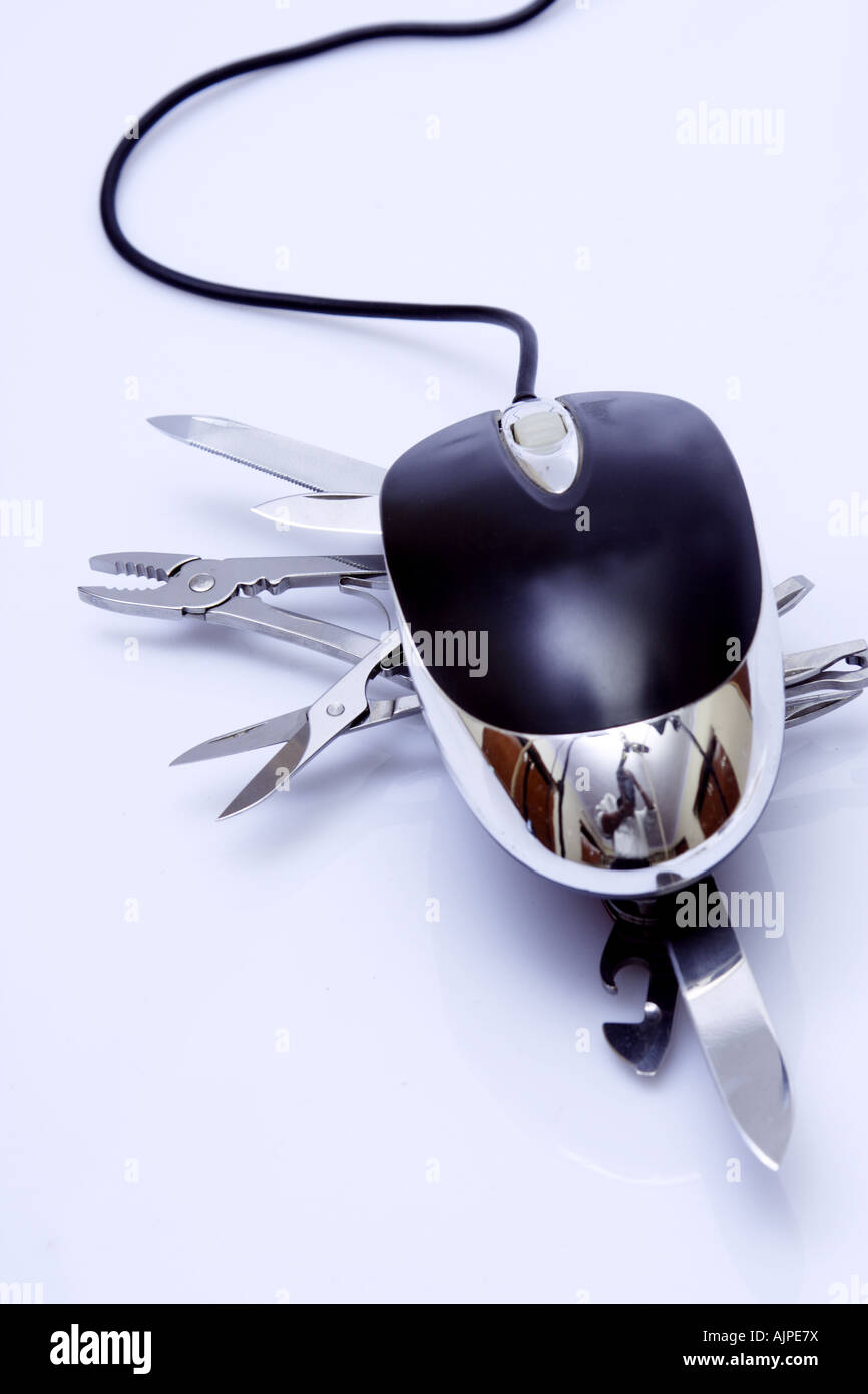 Close up shot of a army knife and a computer mouse Stock Photo - Alamy