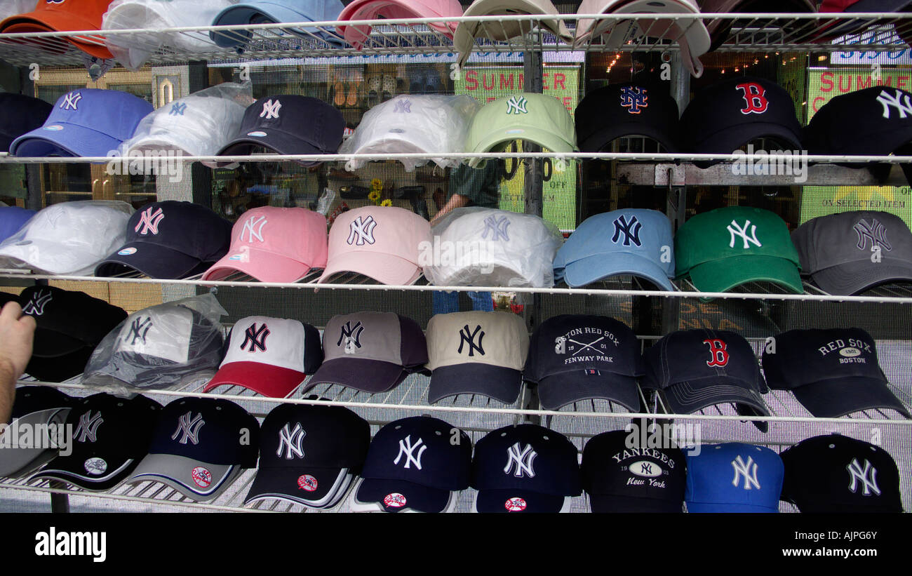 Rows of New York and Boston Red Sox baseball caps for sale in a New York street market Stock Photo