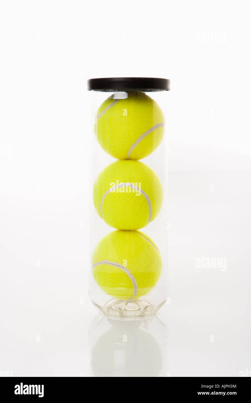 New tennis balls stacked in plastic container Stock Photo Alamy