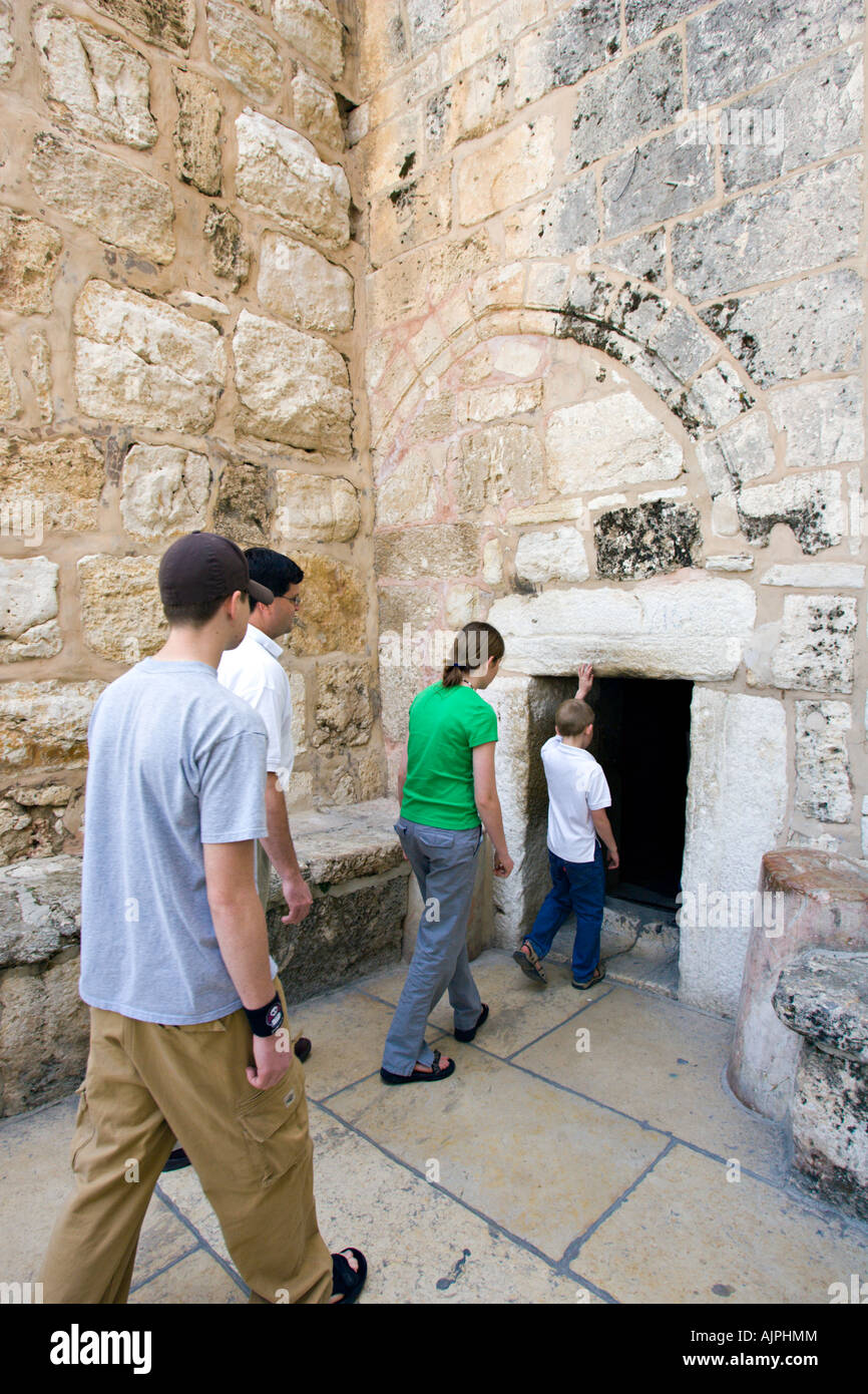 ISRAEL BETHLEHEM Church of the Nativity Family enters low door into the