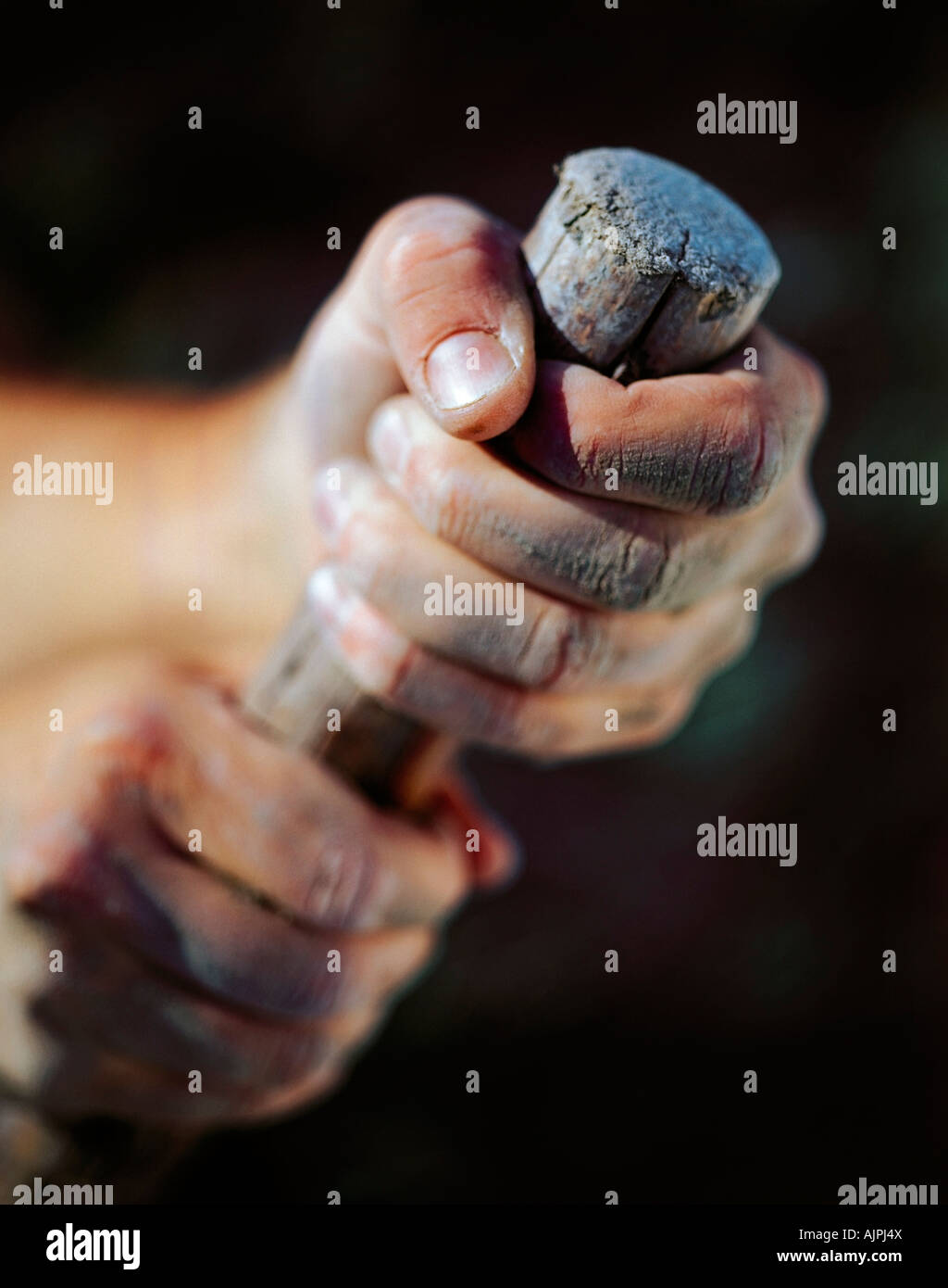 A person holding wood Stock Photo