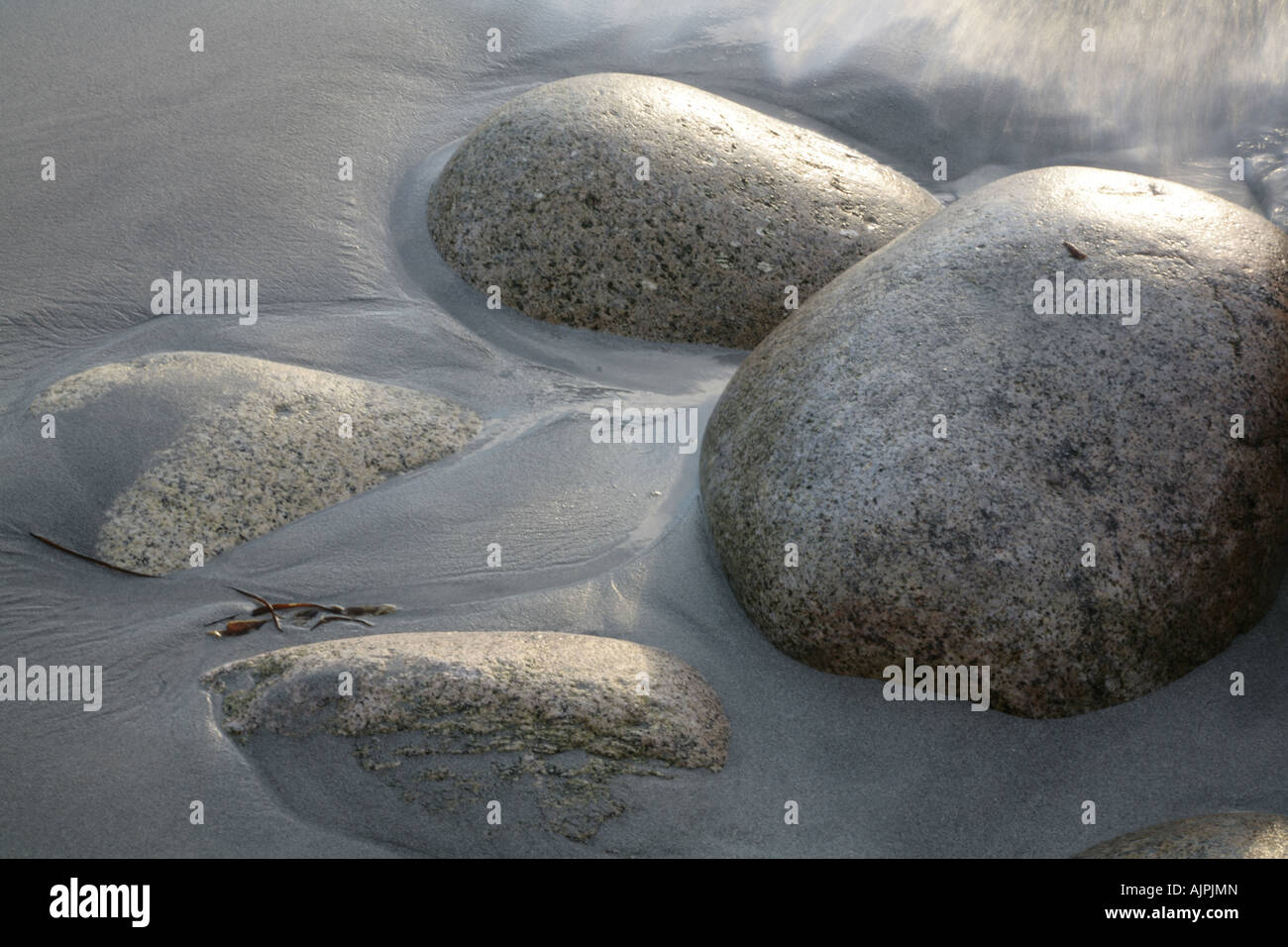Smooth Surfaced Rocks Smooth surfaced rocks in sand at Porth Nanven near St Just, Cornwall ...