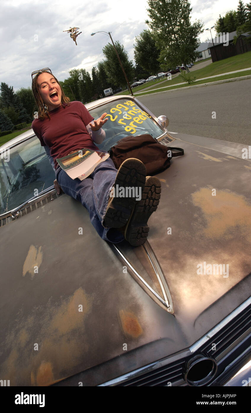 Front view of a girl sitting on car Stock Photo Alamy