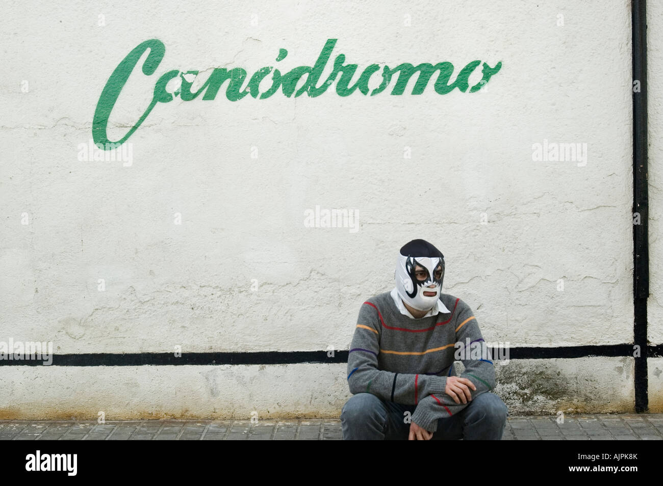 Man with mexican mask near the dog track. Barcelona, Spain Stock Photo